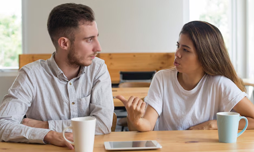 A couple in a serious conversation_