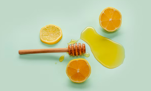 Top-view-honey-stick-and-lemon-slices